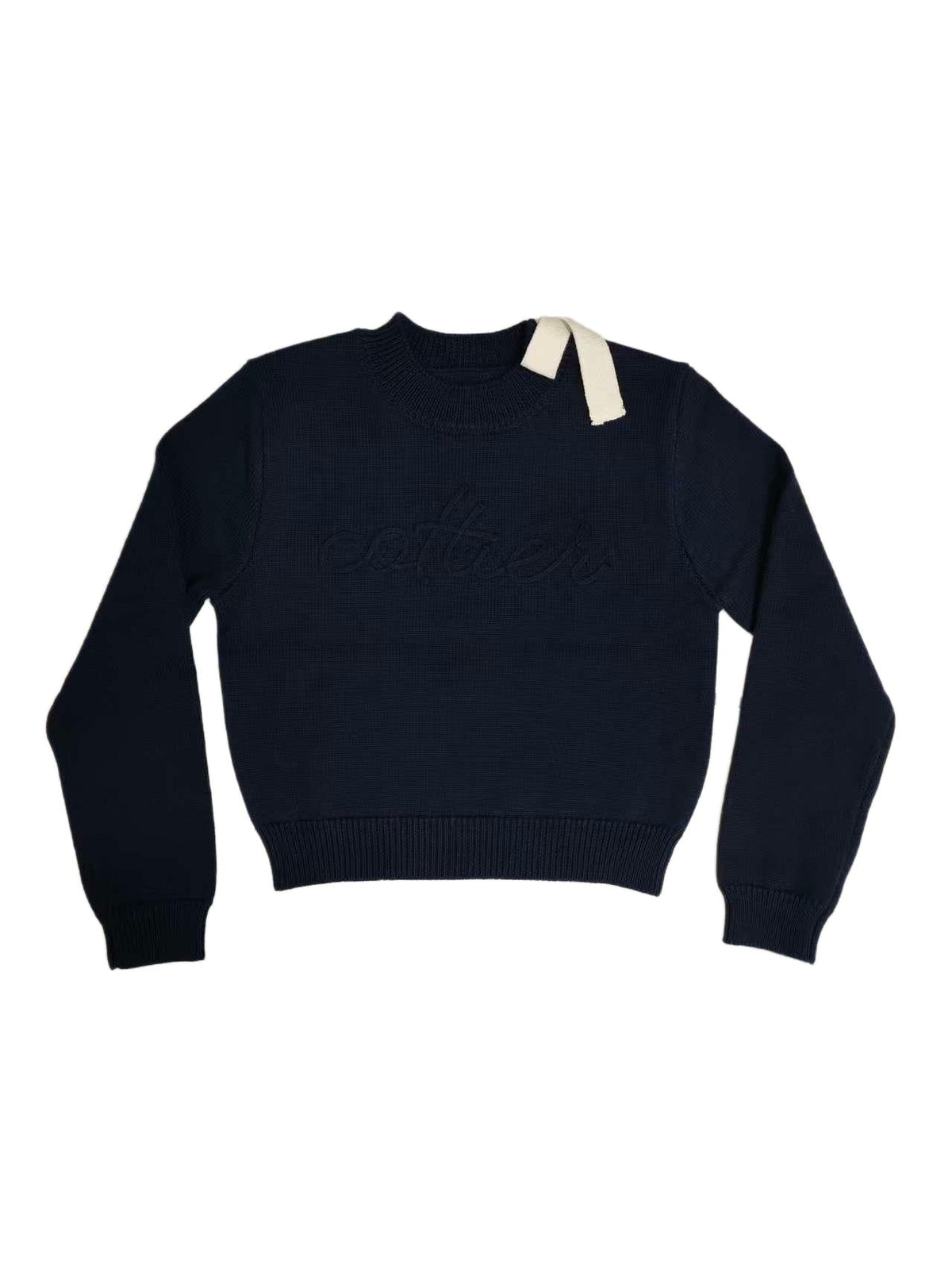 Navy chunky knit top with a shoulder bow and "Cottier" lettering knit into the front