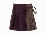 Maroon pinstripe wrap skirt with contrast detail and a small pearlized logo