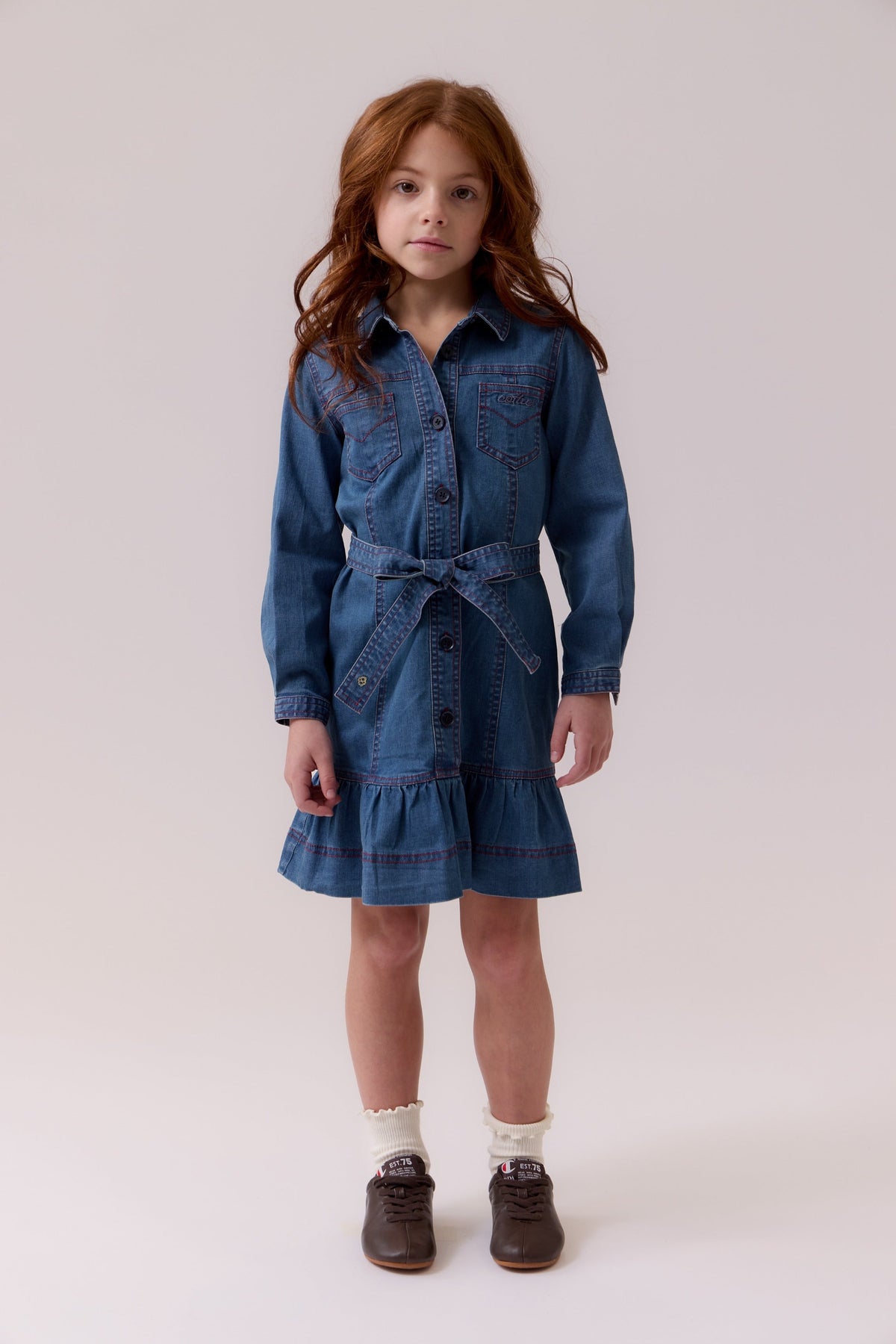 Blue denim dress with a tie belt and red contrast stitching