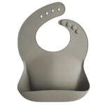 Mushie Silicone Baby Bib with Adjustable Neck Strap and Front Pocket for Easy Cleaning - Baby & Toddler > Nursing & Feeding > Bibs Silicone Bib