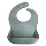 Mushie Silicone Baby Bib with Adjustable Neck Strap and Front Pocket for Easy Cleaning - Baby & Toddler > Nursing & Feeding > Bibs Silicone Bib