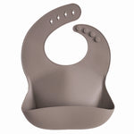 Mushie Silicone Baby Bib with Adjustable Neck Strap and Front Pocket for Easy Cleaning - Baby & Toddler > Nursing & Feeding > Bibs Silicone Bib