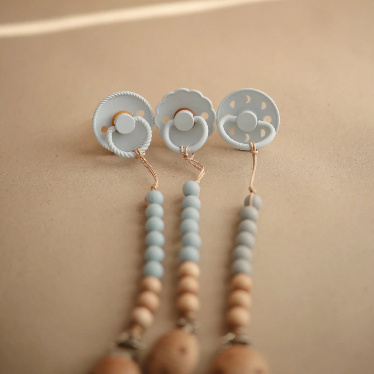 Silicone Pacifier Clip Eva with Faux Wood Clasp and Colorful Beads Mushie Everetts Place: Online Boutique