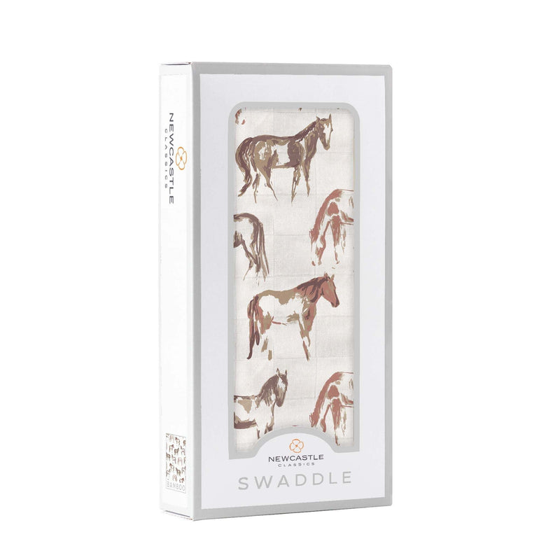 Wild Horses Bamboo Swaddle in packaging, featuring breathable 100% bamboo muslin.