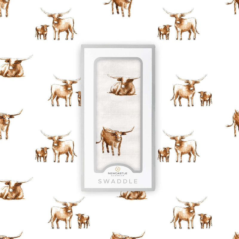 Longhorn Swaddle in packaging with longhorn pattern, made from soft, breathable 100% bamboo muslin.