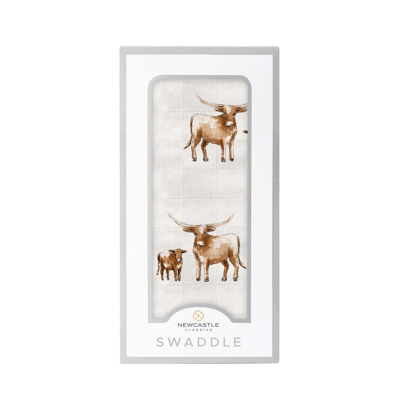 Longhorn Swaddle made from natural bamboo muslin, featuring longhorn design in packaging.