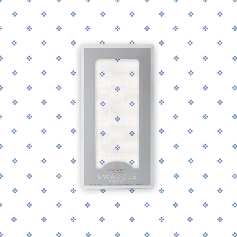 Periwinkle diamond polka dot swaddle in packaging, 100% bamboo muslin, 47x47 inches.