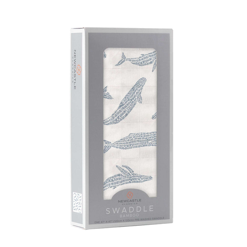Blue Shadow Whales bamboo swaddle in packaging, soft and breathable muslin fabric.