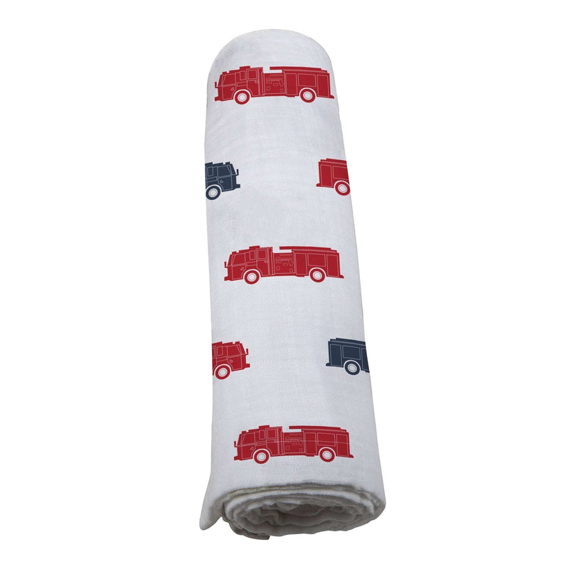 Blue and red fire trucks swaddle featuring soft, 100% natural cotton muslin.