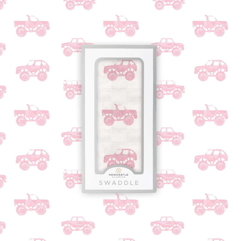 Pink monster trucks bamboo muslin swaddle blanket with breathable fabric.