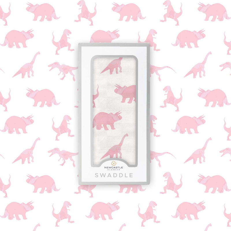 Pink dinosaur bamboo muslin swaddle in box, 100% natural and breathable.