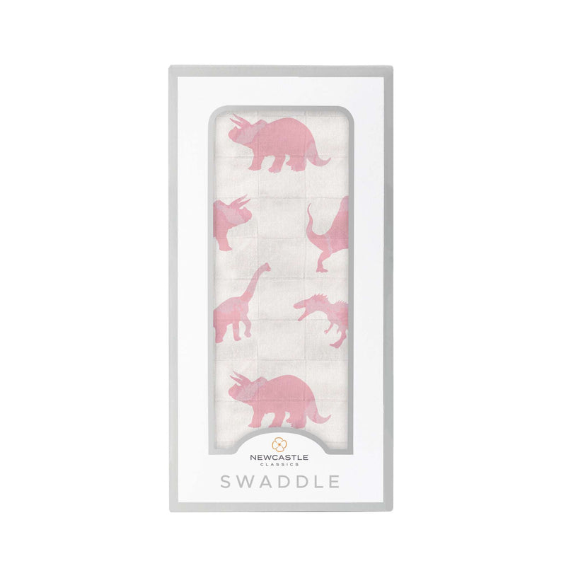 Pink dinosaur pattern bamboo muslin swaddle blanket in packaging.