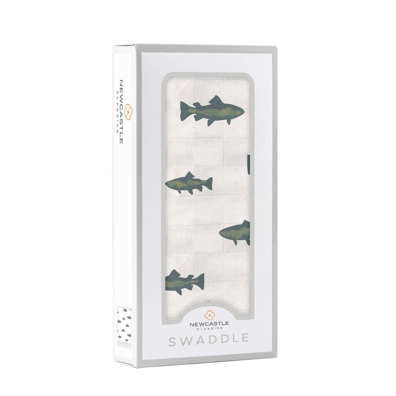 Gone Fishing Swaddle in packaging with fish pattern, made from soft bamboo muslin.
