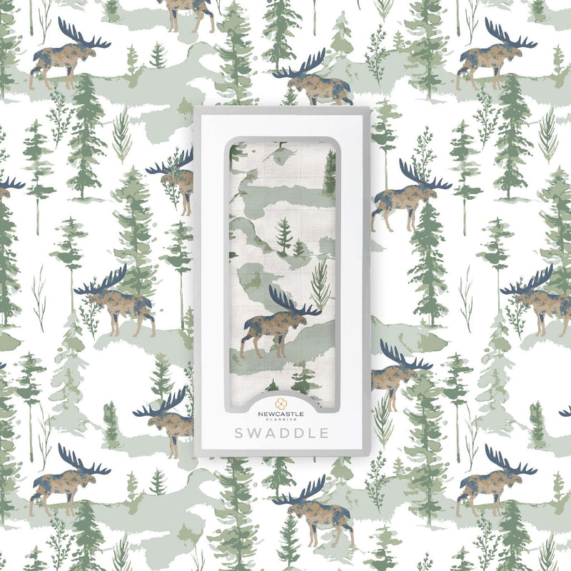 Mountain Moose Swaddle in natural bamboo muslin with moose and forest print pattern.