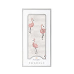 Bamboo muslin baby swaddle blanket with a pink dancing flamingo pattern