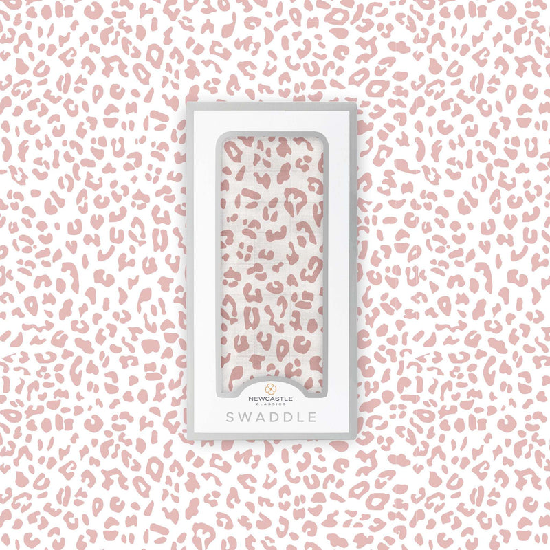 Little Leopard Swaddle in packaging with pink leopard print design, made from soft natural bamboo muslin.