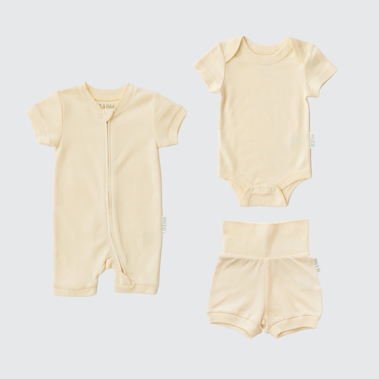 Sunny yellow three-piece baby set with short sleeve romper, bodysuit, and fold-over shorts