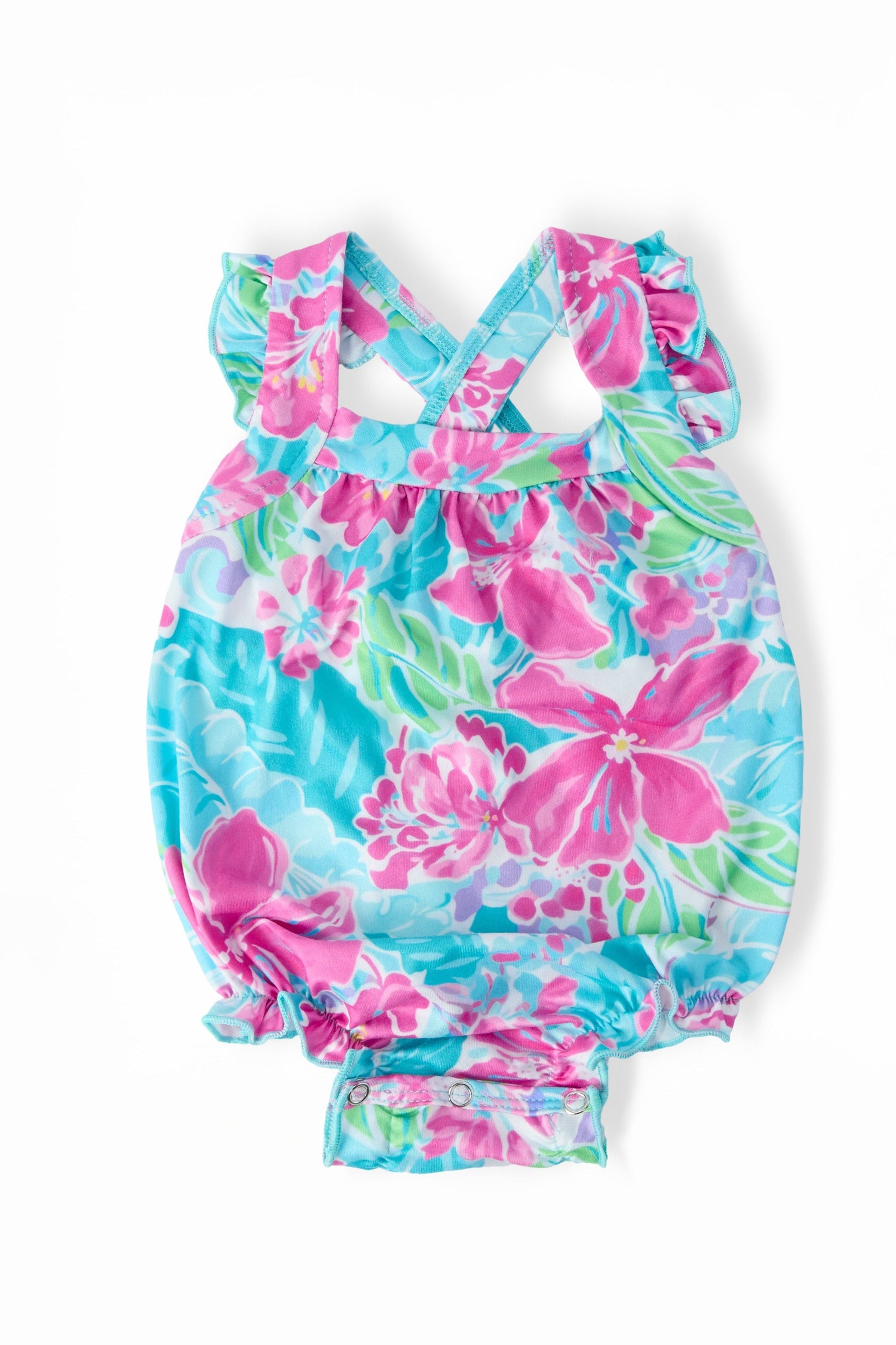 Baby romper in bright tropical print with shoulder ruffle and criss-cross back straps