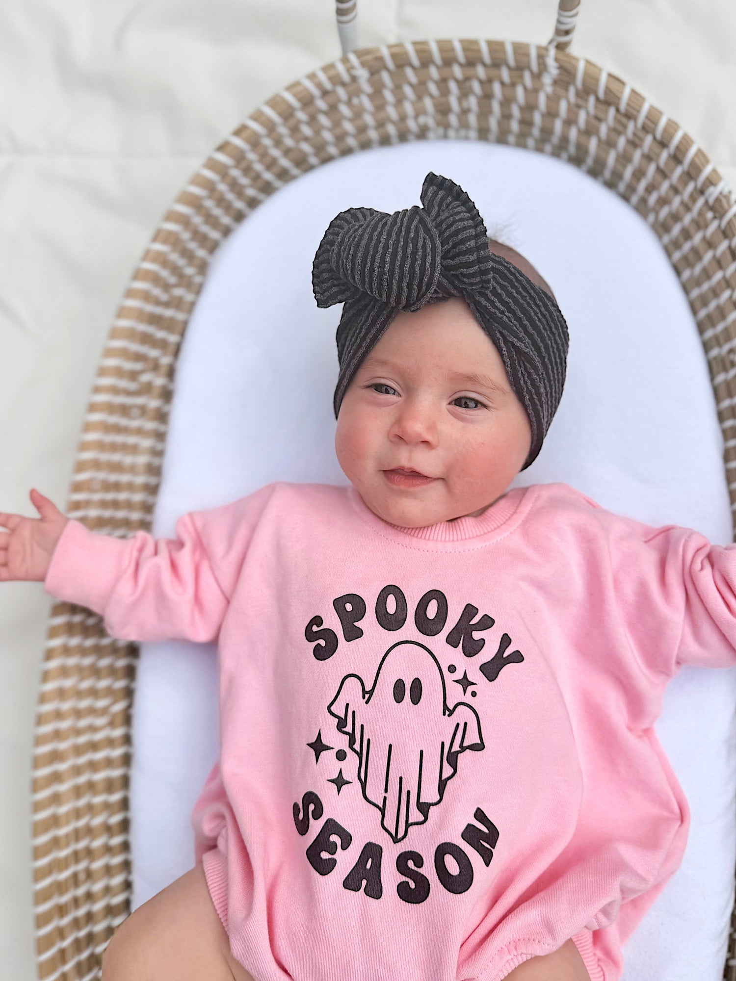 Oversized sweatshirt romper with screenprinted "Spooky Season" graphic and snaps at the crotch.