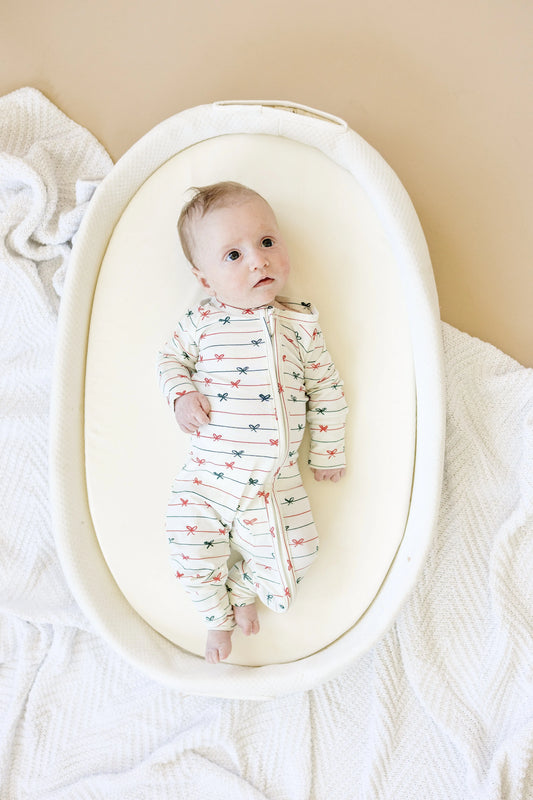 Tied With a Bow Christmas Bamboo Zippy Romper for Babies Little Joy Co. Everetts Place: Online Boutique