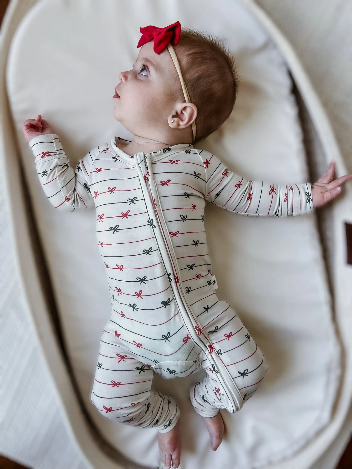 Tied With a Bow Christmas Bamboo Zippy Romper for Babies Little Joy Co. Everetts Place: Online Boutique