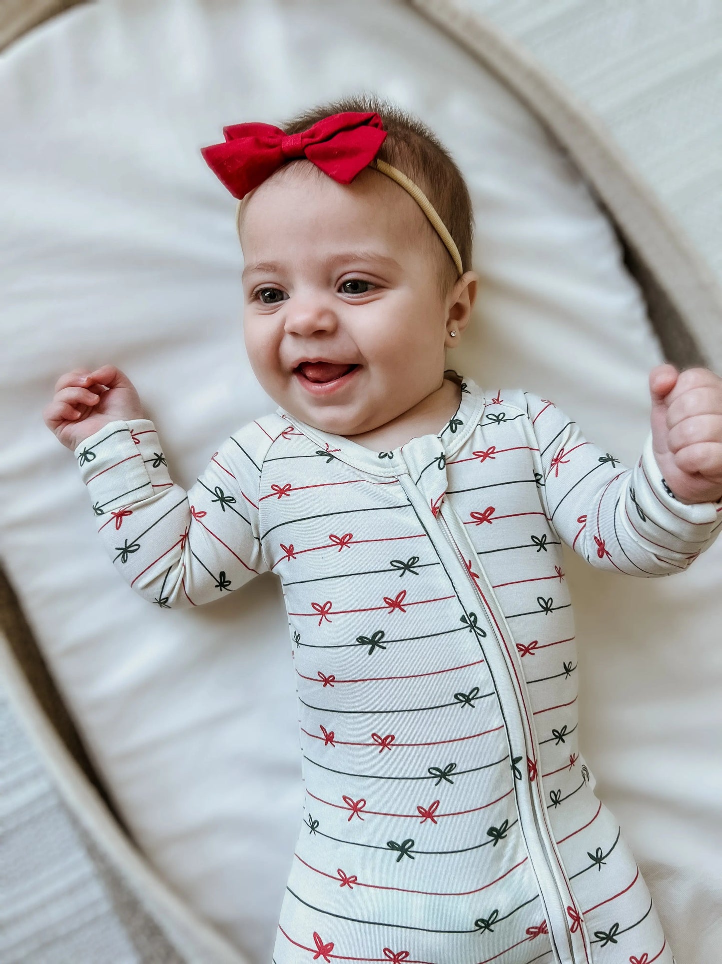 Tied With a Bow Christmas Bamboo Zippy Romper for Babies Little Joy Co. Everetts Place: Online Boutique