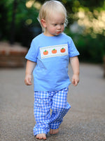 Baby boy two-piece set with a smock featuring blue pumpkin embroidery for fall and Halloween.