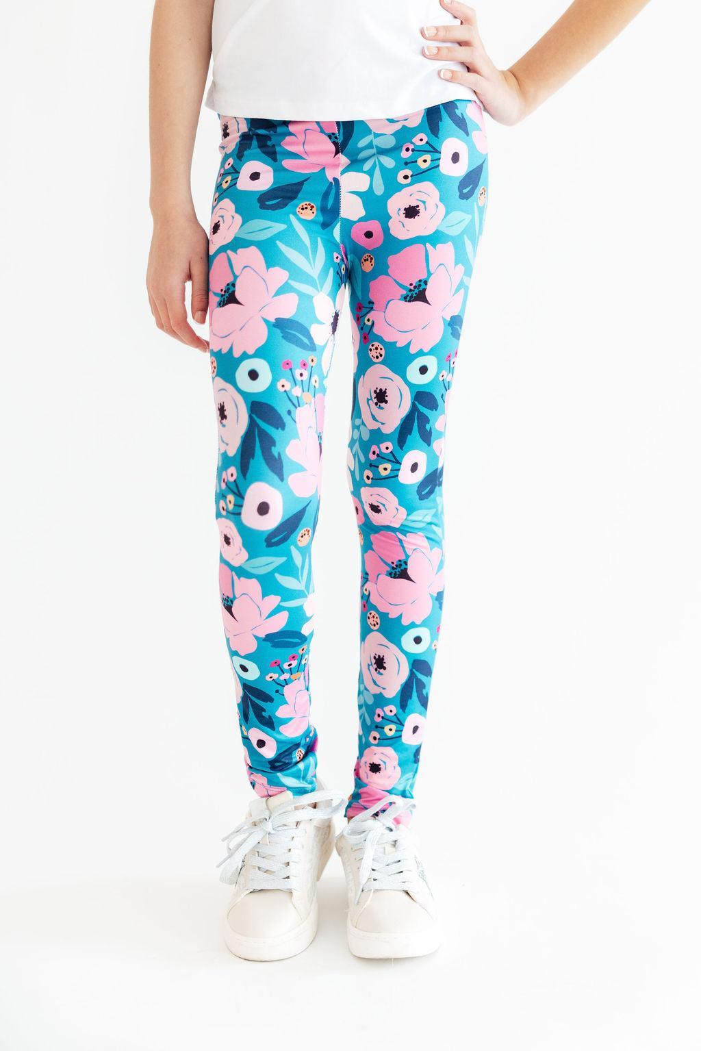 Mila & Rose organic baby Twirling in Teal Leggings.