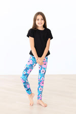 Mila & Rose Twirling in Teal organic baby leggings.