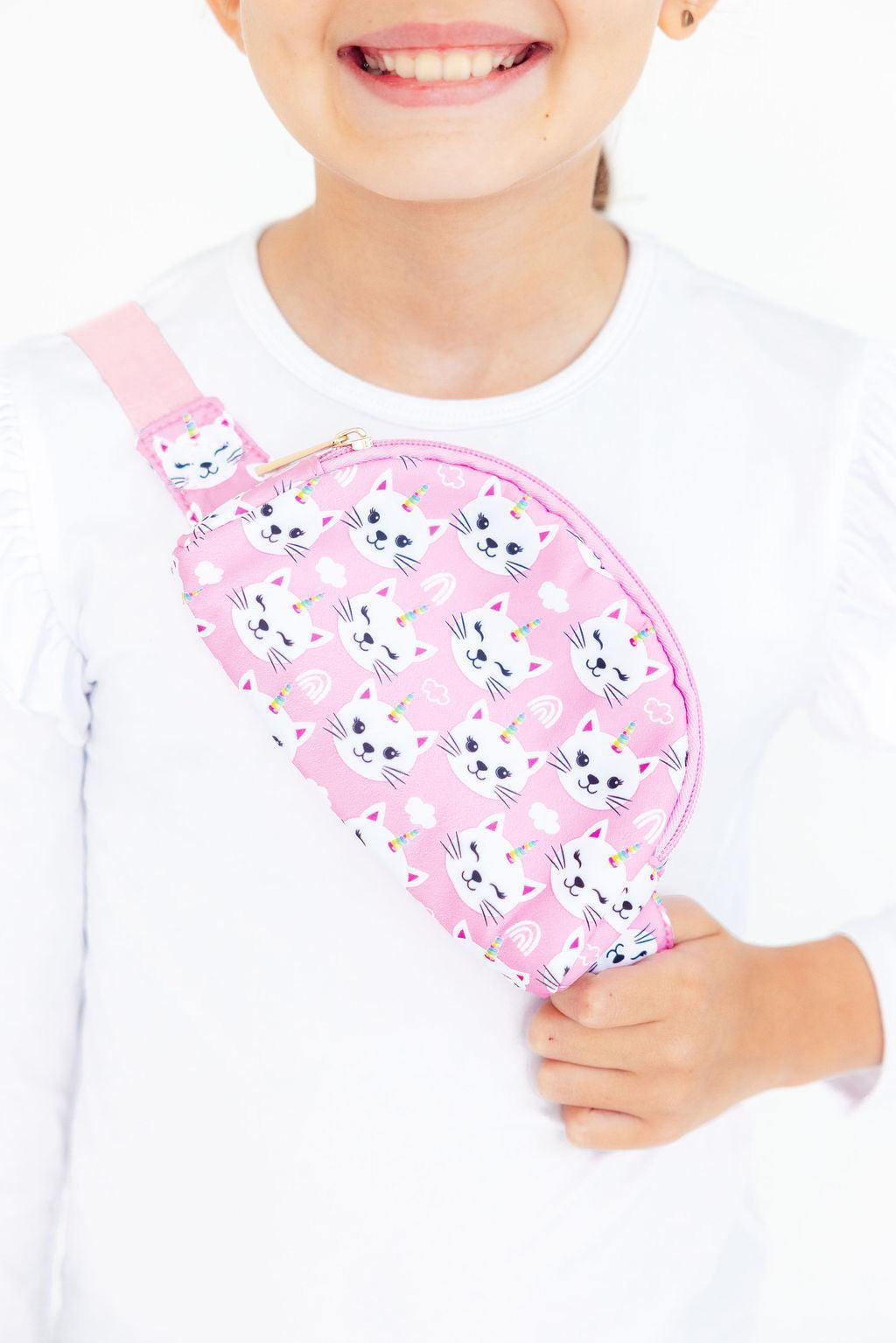 Belt bag with a unicorn kitty print and adjustable strap for wearing at the waist or cross body