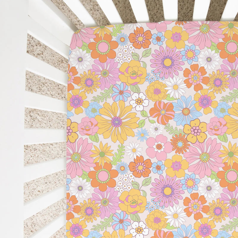 Retro floral fitted crib sheet with colorful flower pattern in standard crib.