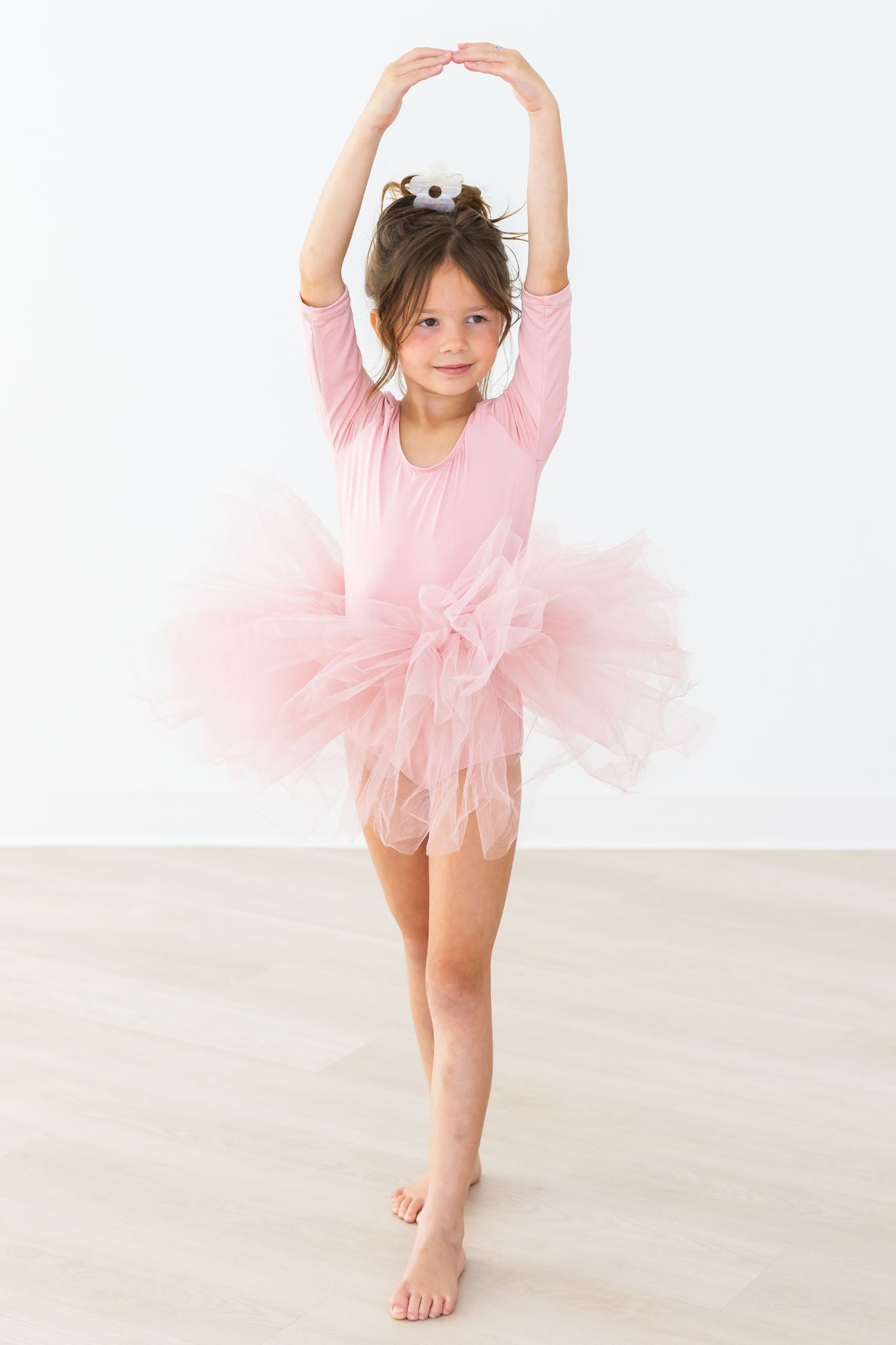 Vintage pink tutu leotard with a full layered skirt and short sleeves