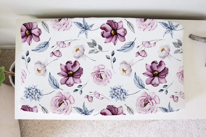 Vintage floral changing pad cover with a soft, stretchy fabric.
