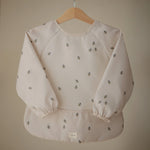 Mushie Water Resistant Long Sleeve Bib for Kids with Wide Pocket and Velcro Closure - Baby & Toddler > Nursing & Feeding > Bibs Long Sleeve Bib
