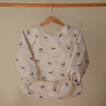 Mushie Water Resistant Long Sleeve Bib for Kids with Wide Pocket and Velcro Closure - Baby & Toddler > Nursing & Feeding > Bibs Long Sleeve Bib