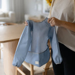 Mushie Water Resistant Long Sleeve Bib for Kids with Wide Pocket and Velcro Closure - Baby & Toddler > Nursing & Feeding > Bibs Long Sleeve Bib
