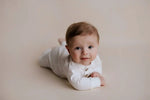 Three Little Tots White Baby Ribbed Playsuit with pockets - 