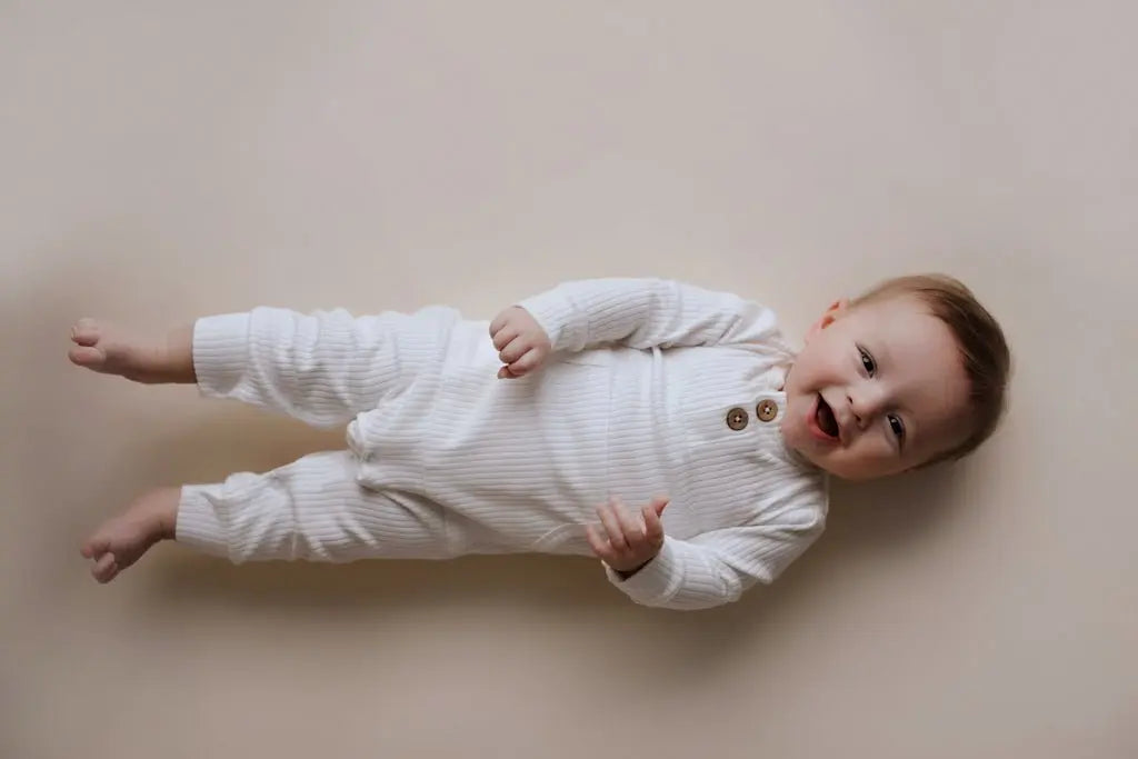 Three Little Tots White Baby Ribbed Playsuit with pockets - 