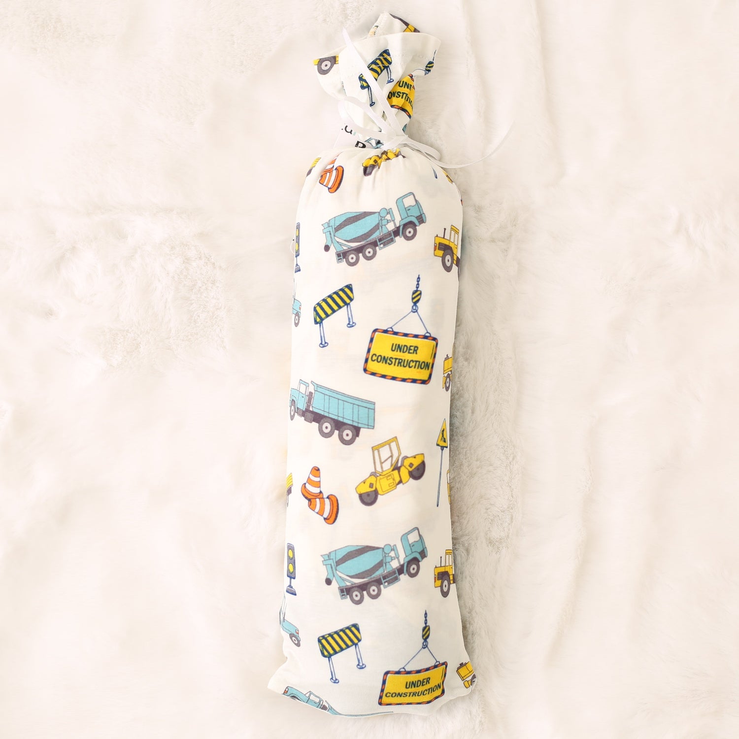 Bamboo swaddle blanket with a busy builders construction print of trucks and tools