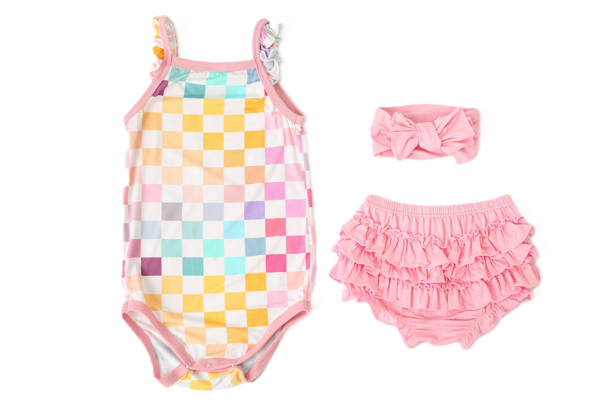 Pastel checked baby bloomer set with matching bodysuit and a stretchy headband