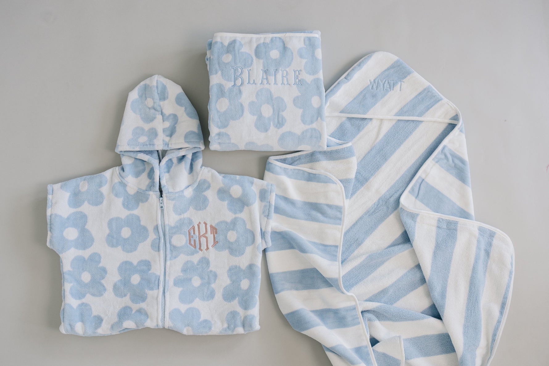 Mebie Baby Coastal Floral Hooded Towel featuring a delicate, colorful floral pattern on soft fabric.