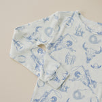 Two-piece ribbed baby pajama set with a blue cowboy print on top and pants