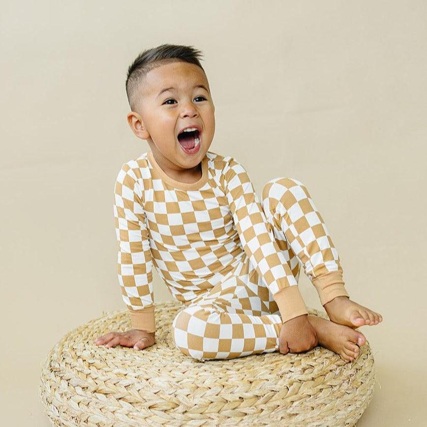 Two-piece bamboo pajama set in a golden yellow check pattern with long-sleeve top and pants