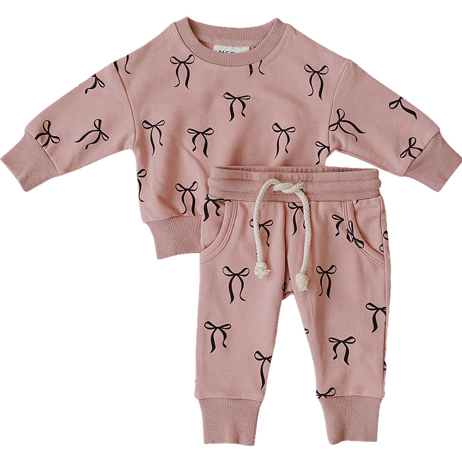 Two-piece French terry top and bottom set in blush with a bow print