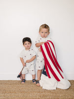 Mebie Baby baby short set with flag-themed buttons.