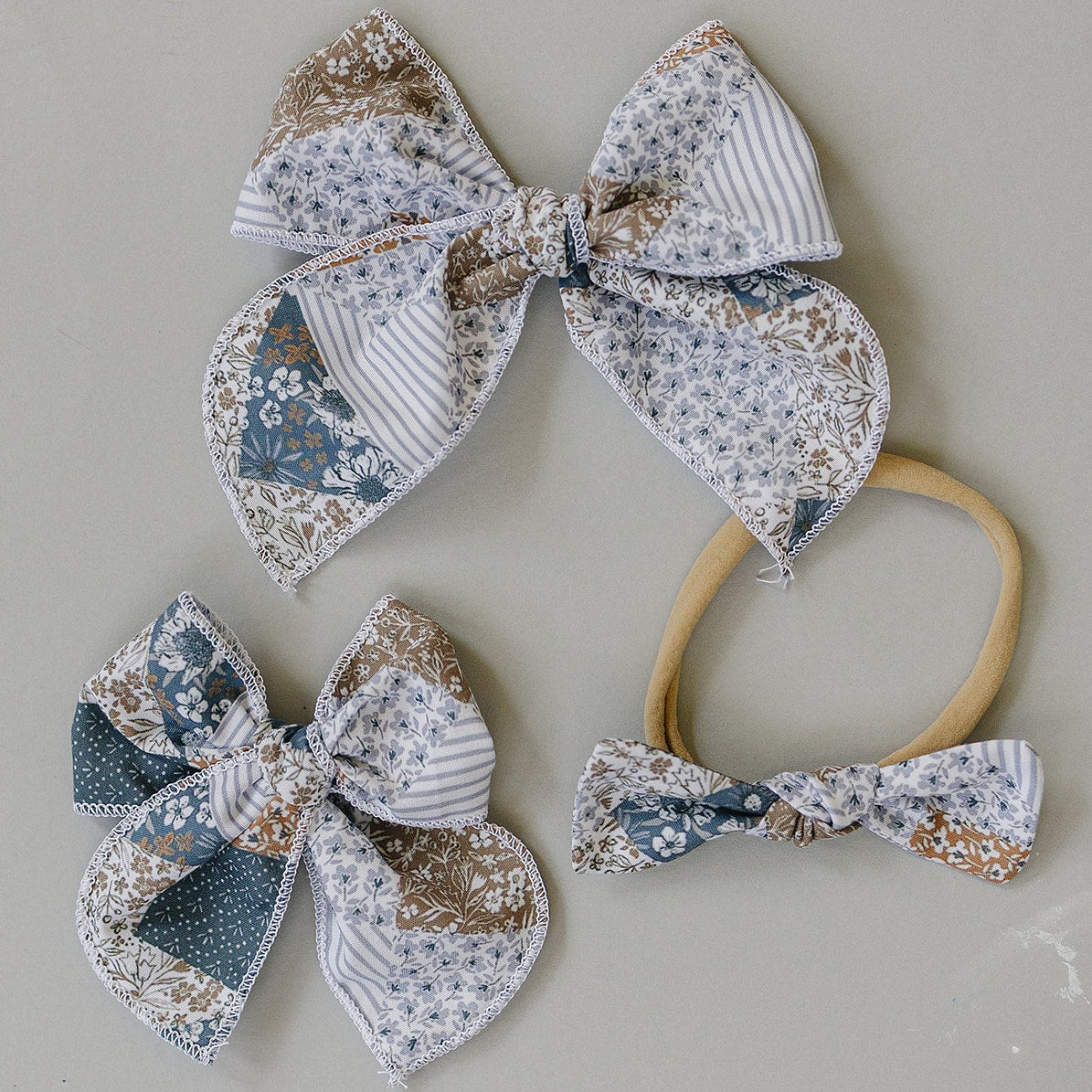Handcrafted fabric hair bow in patchwork print