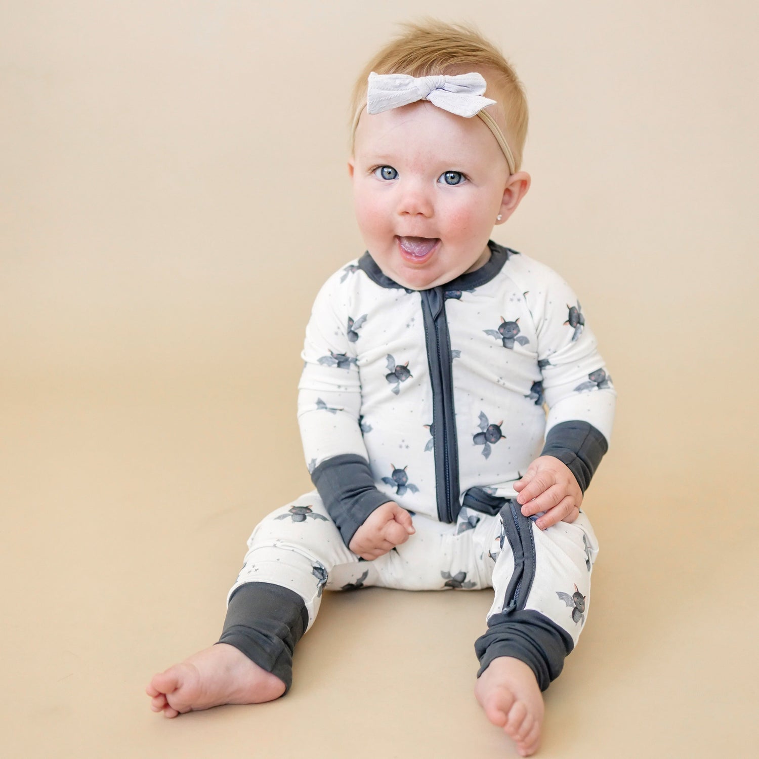 Baby zipper romper with foldover feet in a bat print for newborns