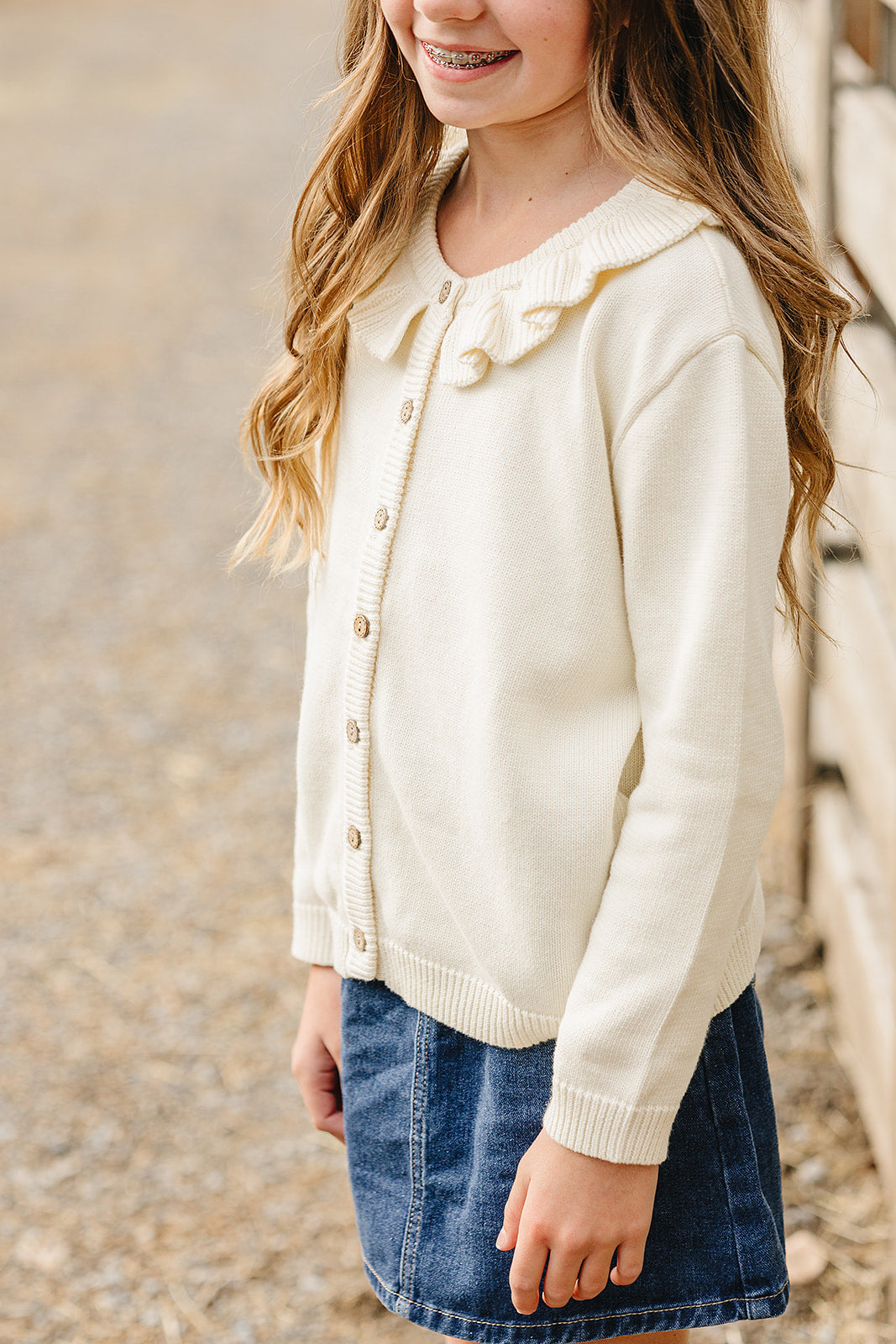 Cream Ruffle Knit Cardigan by Mebie Baby