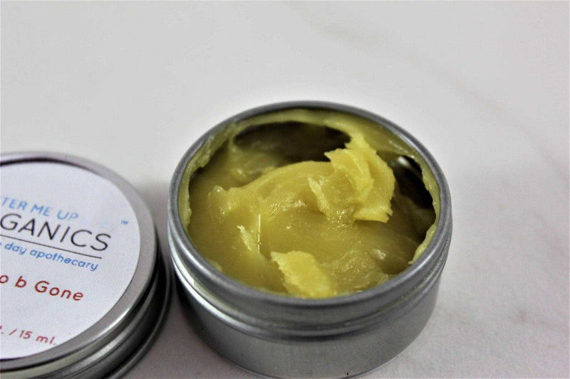 All Natural Neosporin salve in metal tin, open to show herbal-infused balm.