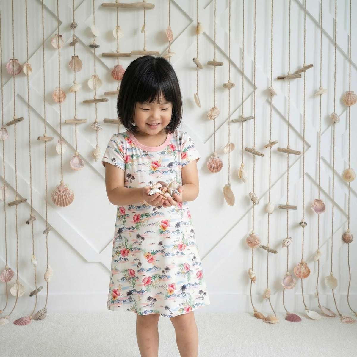 Short sleeve A-line toddler dress in bamboo fabric with an Aloha print and full twirl skirt